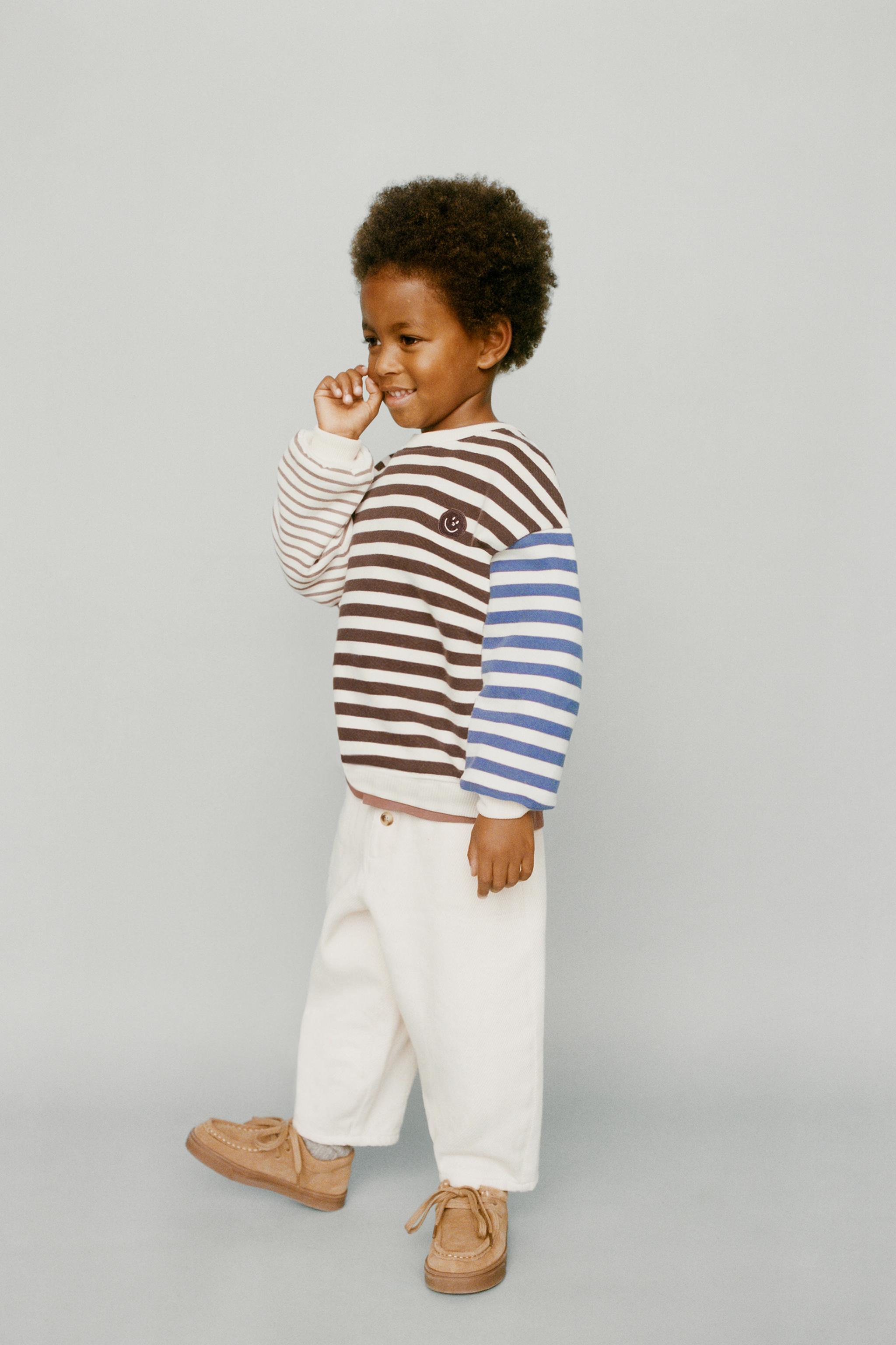 STRIPED SWEATSHIRT WITH FACE PATCH
